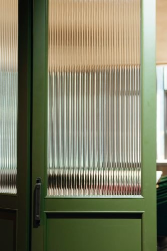Curtains block all light. Frosted glass costs $800+. Decorative film gives 100% privacy while keeping 60-80% of natural light. Elegant patterns, one-day install.